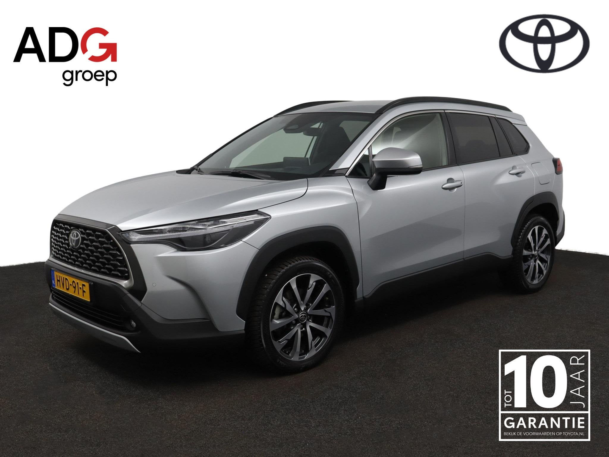 Toyota Corolla Cross Hybrid 140 Style | Elektrisch bedienbar, Auto's, Stof, Gebruikt, 4 cilinders, Parkeersensor