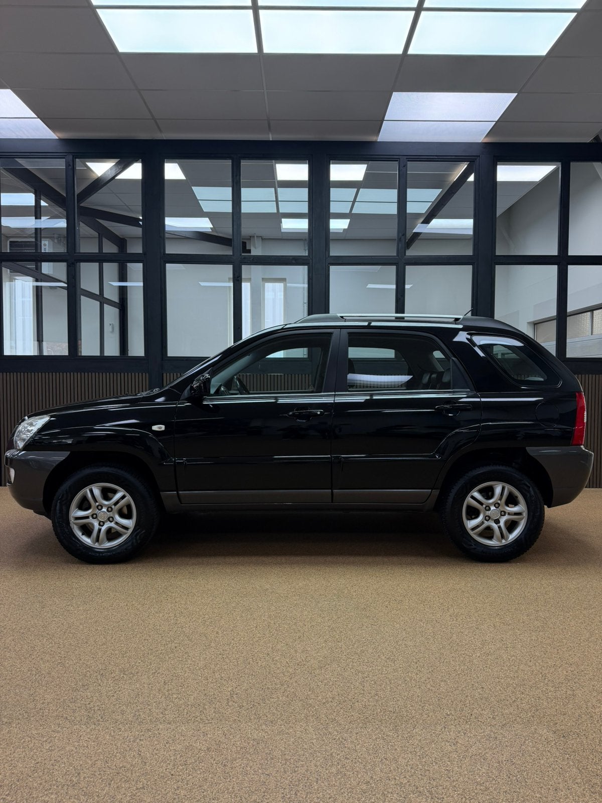 Kia Sportage 2.0 CVVT Comfort | 1e Eig. | Nw. APK | Airco |, Auto's, 1442 kg, 4 cilinders, Zwart, Origineel Nederlands