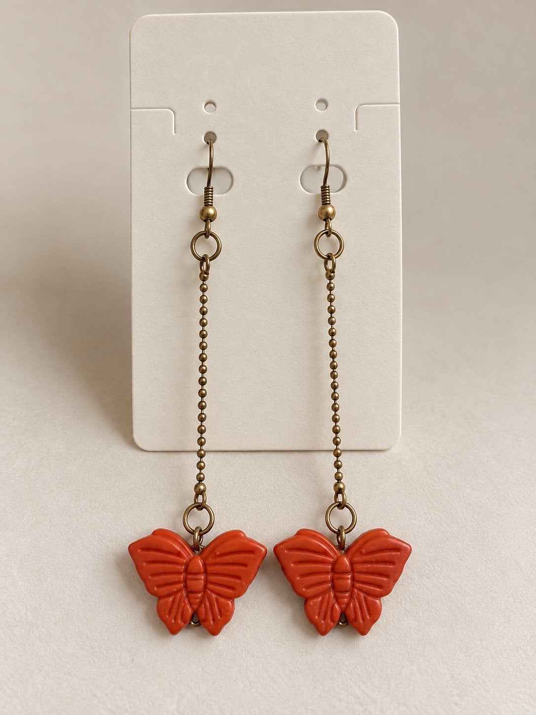 Lange oorbellen met oranje vlinders, Overige materialen, Hangers, Oranje, Ophalen of Verzenden