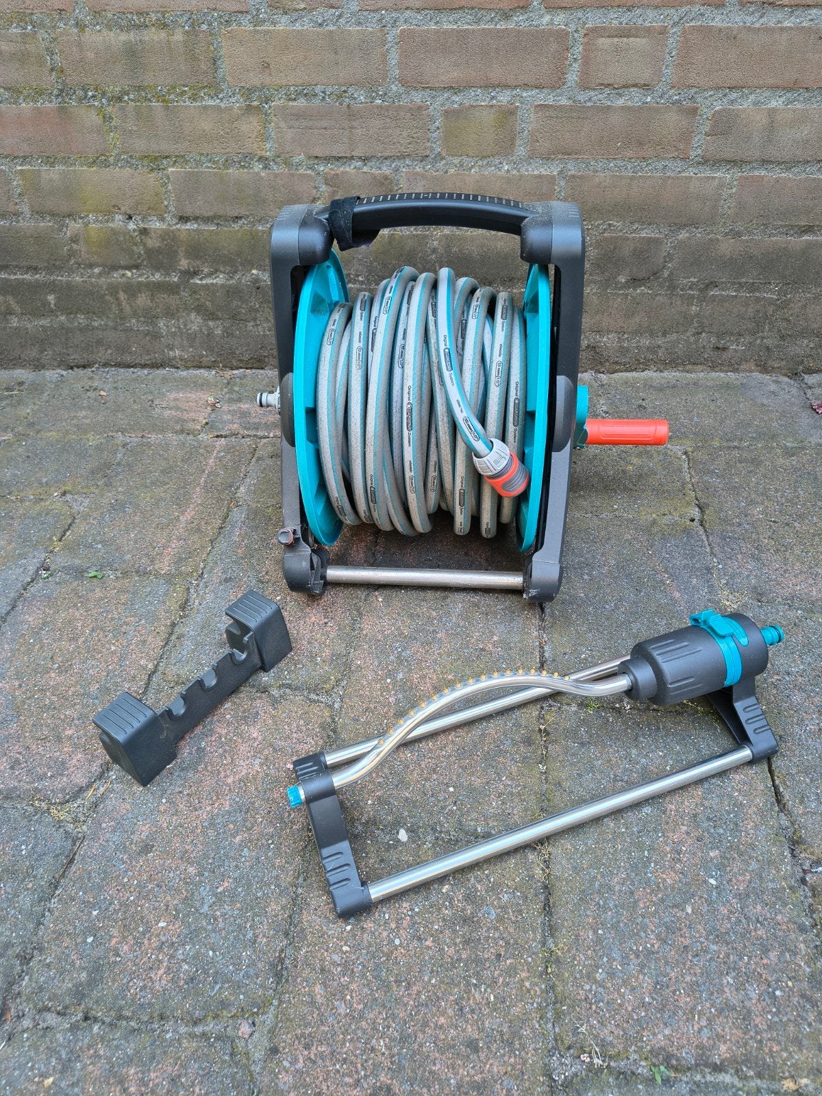 Gardena slanghouder incl. 15m slang en beregeningsonderdeel, Ophalen of Verzenden, Tuinslang