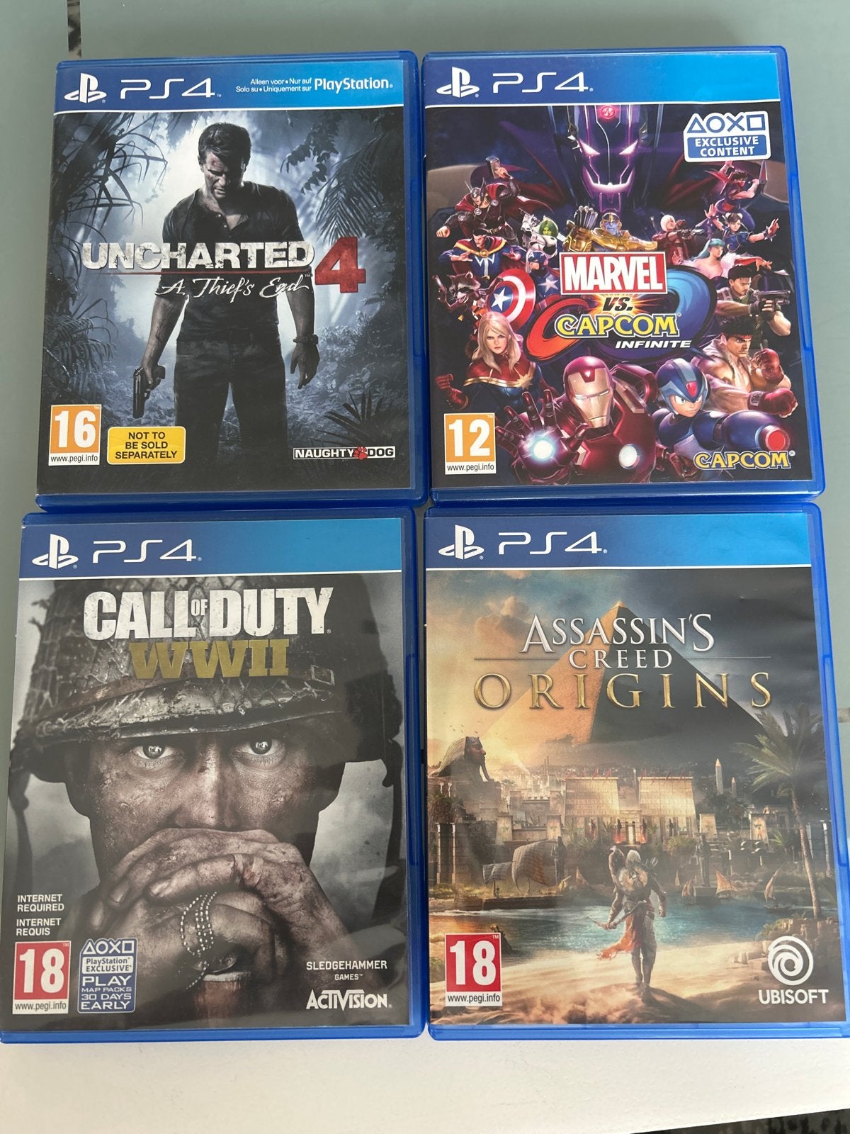 PS4 Games Bundel: Uncharted 4, CoD WWII, AC Origins, Marvel, Avontuur en Actie, Online, Gebruikt, Vanaf 18 jaar