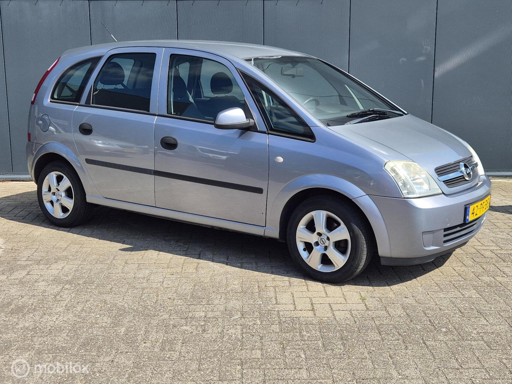 Opel Meriva 1.6 Cosmo|APK 5-2027, Metallic lak, Gebruikt, 4 cilinders, Origineel Nederlands