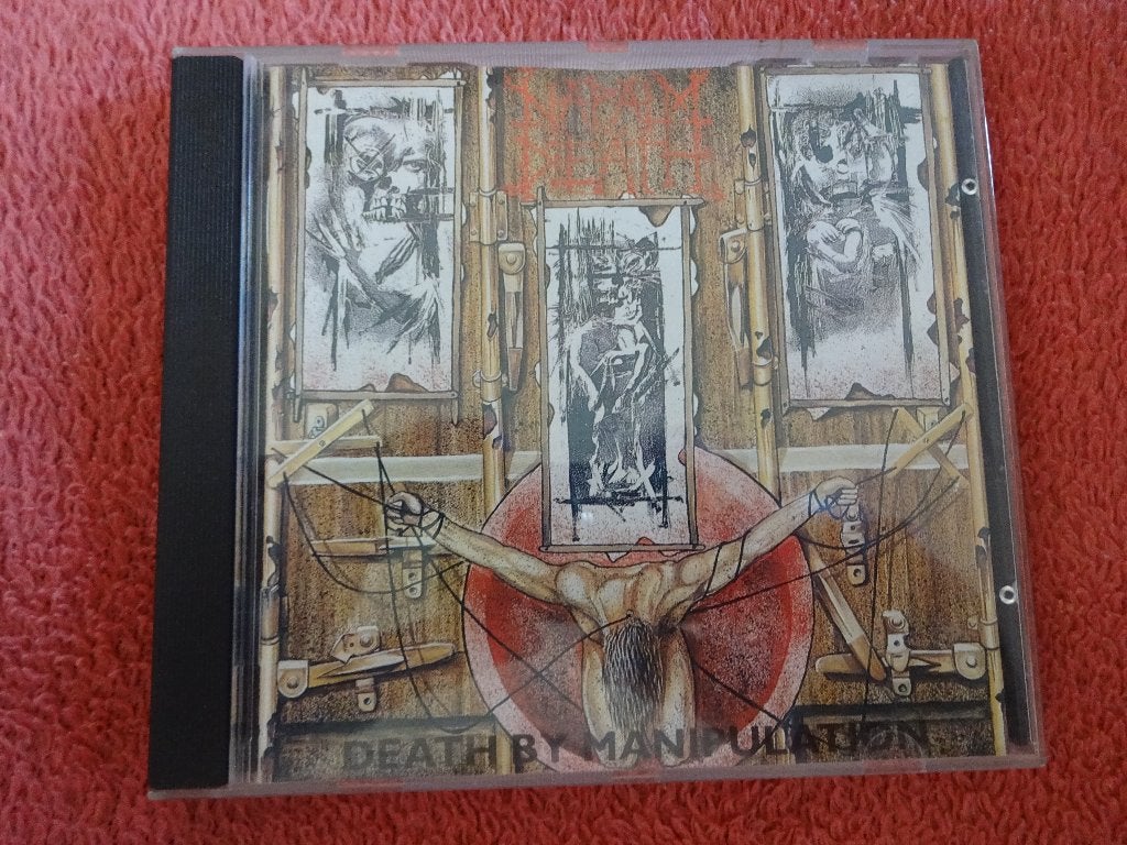 CD Napalm Death – Death By Manipulation , MOSH51 CD, Gebruikt, Death metal, Ophalen of Verzenden, Verzamelalbum