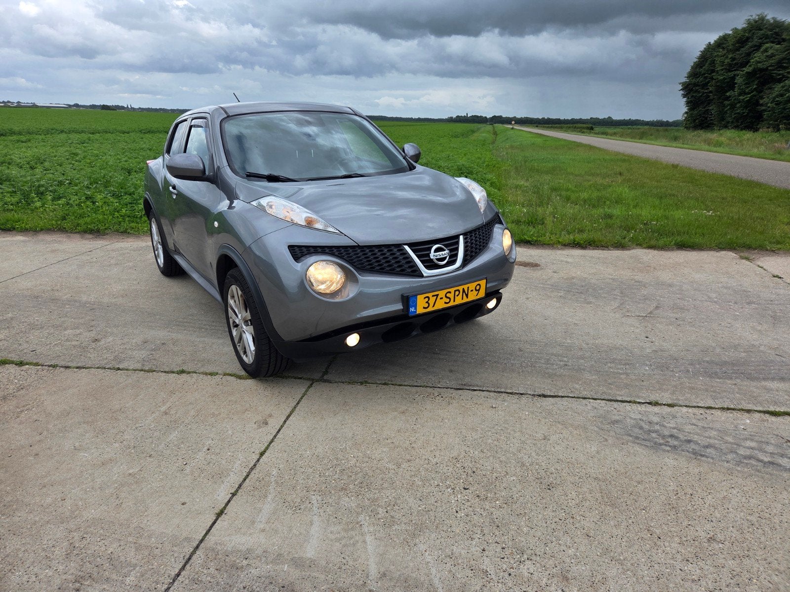Nissan Juke 1.6 Eco 117pk 2011 Grijs, Auto's, Euro 5, Stof, 1250 kg, Zwart