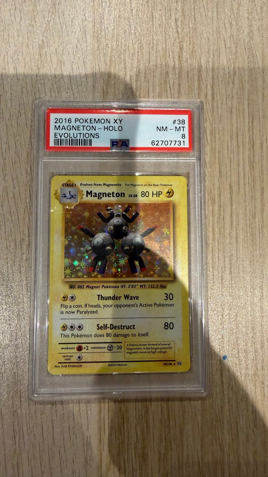 Magneton #38 Holo NM-MT 8 PSA 2016 Pokémon XY Evolutions, Ophalen of Verzenden, Zo goed als nieuw, Losse kaart, Foil