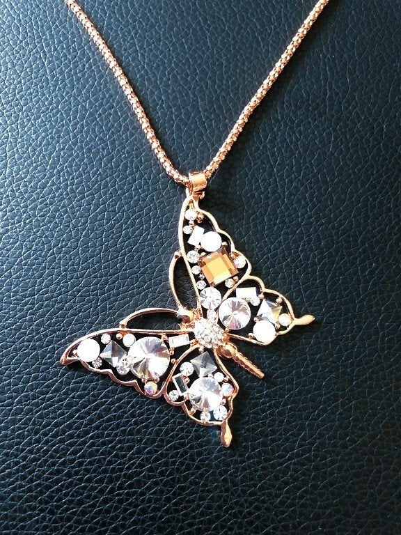 Lange ketting rosé goud met hanger vlinder en kristal - 60cm
