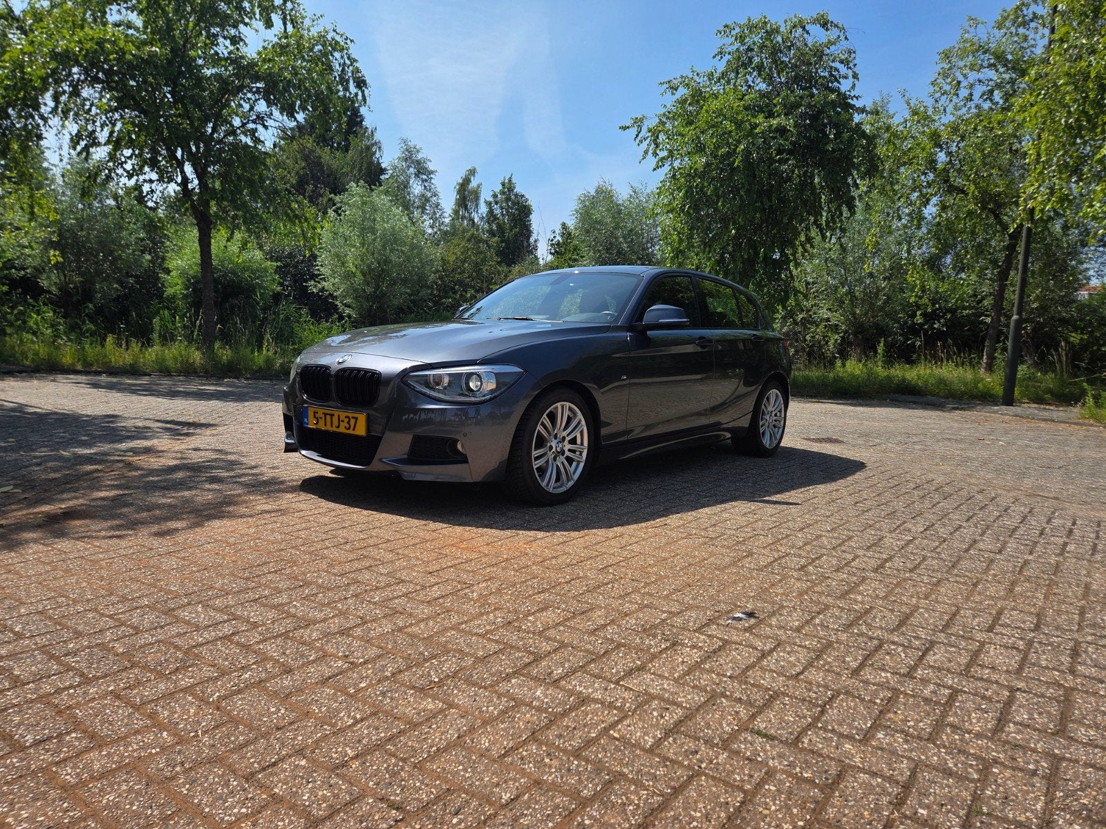 BMW 1-Serie 116i 136PK 5D Aut. 2014 Grijs, Auto's, 4 cilinders, 1200 kg, Particulier, 17 km/l