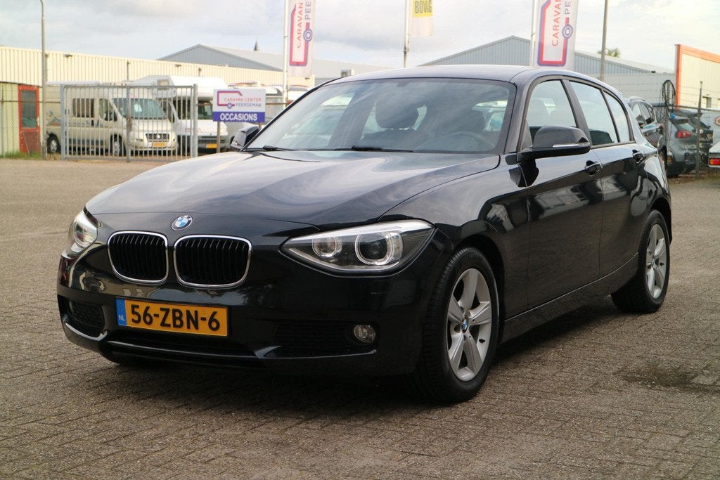 BMW 1-serie 114i Upgrade Edition | Navi | Goed Onderhouden!, Auto's, BMW, 1-Serie, Euro 5, Achterwielaandrijving, Gebruikt