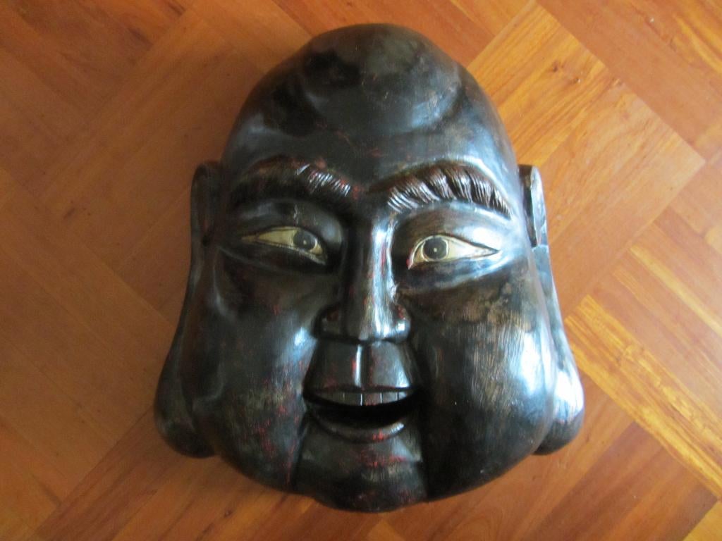 houten Budha, Ophalen
