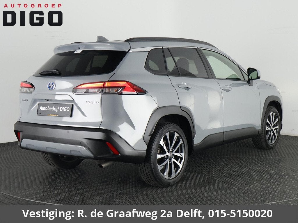 Toyota Corolla Cross 2.0 High Power Hybrid First Edition | A, Gebruikt, 4 cilinders, Leder en Stof, Origineel Nederlands
