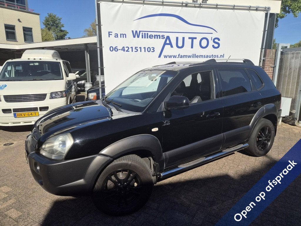 Hyundai Tucson 2.7i V6 4WD Style (bj 2006, automaat), Auto's, Automaat, Gebruikt, Zwart, 2656 cc