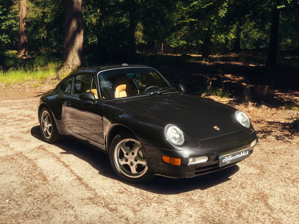 Porsche 911 3.6 Carrera 4 Coupé Handgeschakeld (bj 1995), Auto's, Oldtimers, Cruise Control, 4 stoelen, Zwart, Bedrijf