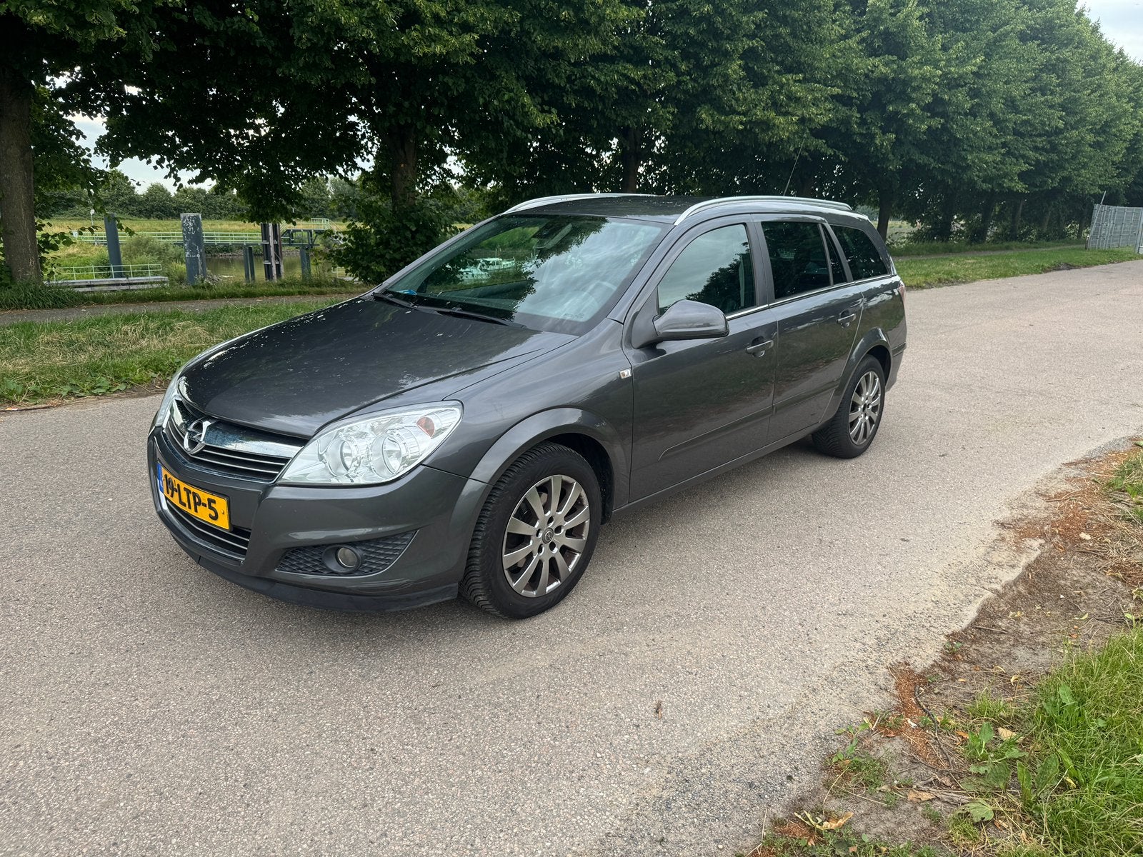 (Automaat) Opel Astra 1.6 16V 85KW St.wgn. Easytronic 2010, Auto's, Zwart, Origineel Nederlands, Stationwagon, 630 kg