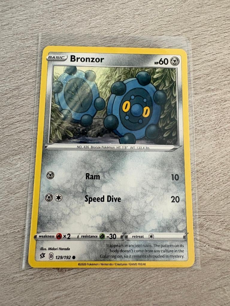 Bronzor 129/192 Rebel Clash - Pokémon Kaart, Ophalen of Verzenden, Nieuw, Losse kaart