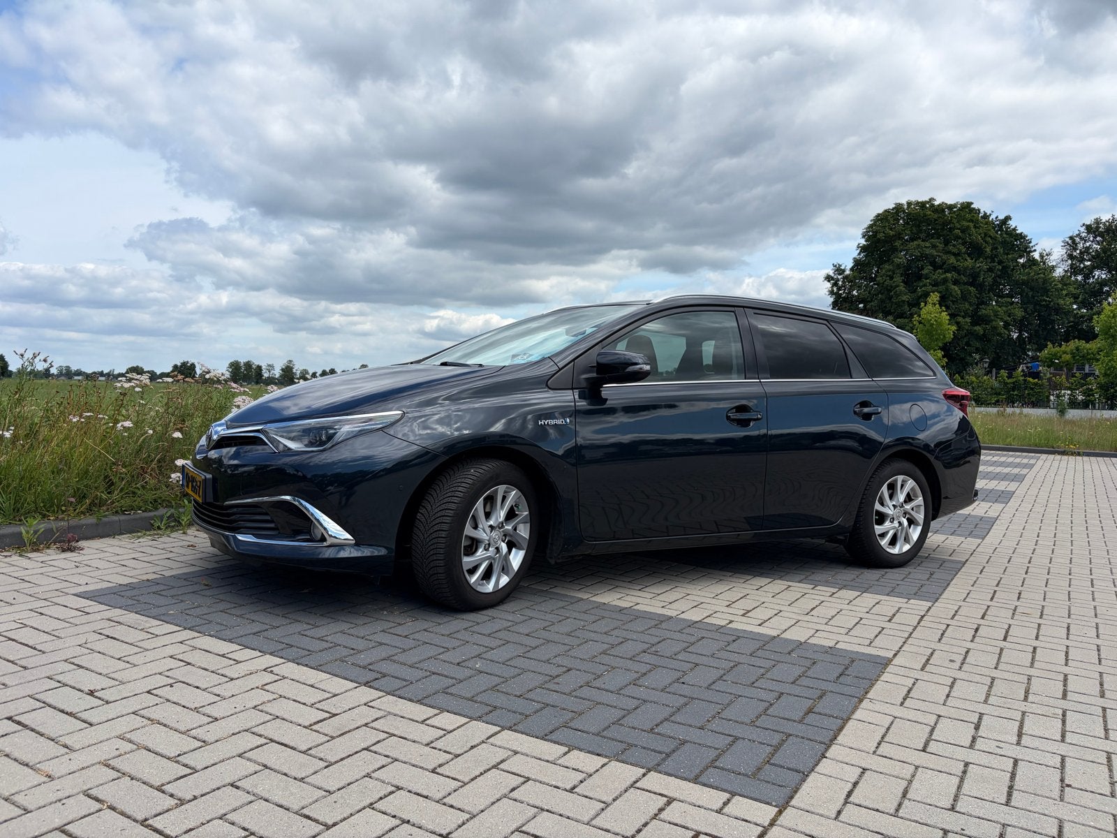 Toyota Auris 1.8 Hybrid Touring Sports CVT 2015 donker BLAUW, Auto's, Toyota, Te koop, 66 €/maand, 5 stoelen, Voorwielaandrijving