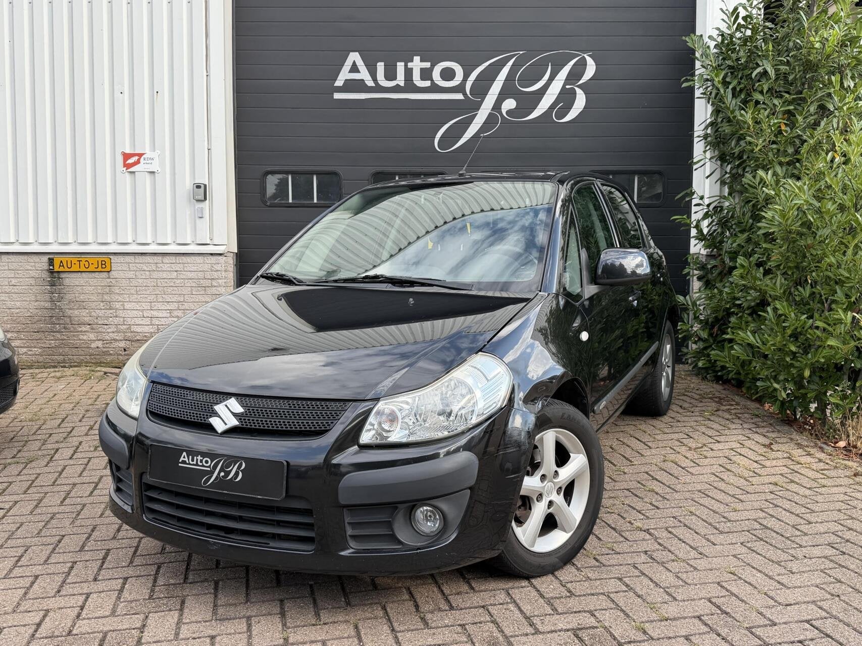 Suzuki SX4 1.6 EXCLUSIVE | CLIMA | TREKHAAK | APK 03-2027!, Auto's, Voorwielaandrijving, Gebruikt, Zwart, Origineel Nederlands