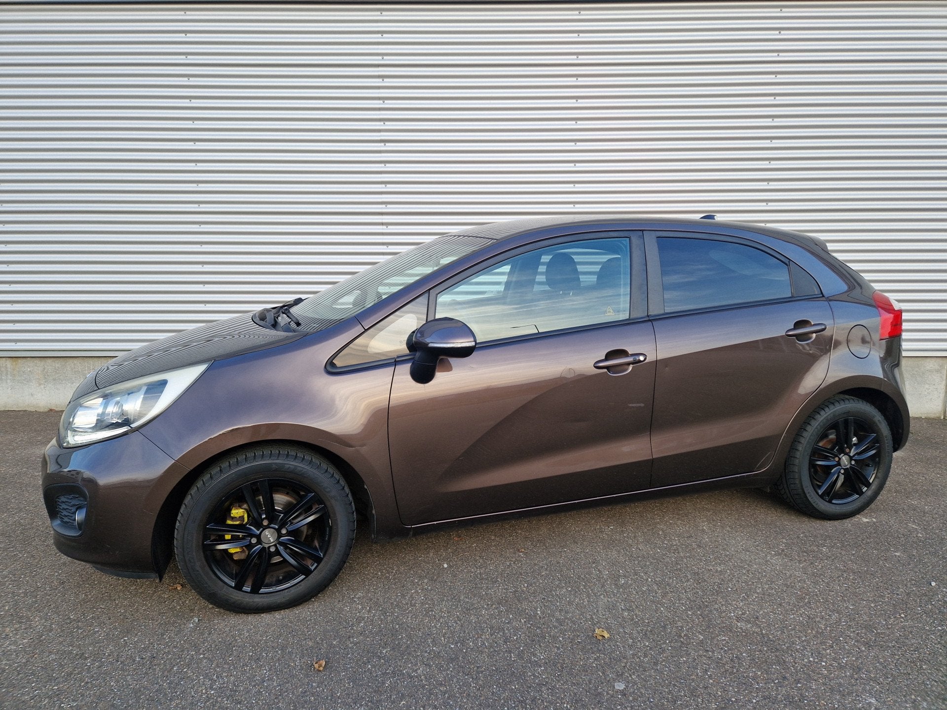Kia Rio 1.2 CVVT Super Pack Climatronic keyless PDC NAP, Auto's, Euro 5, Gebruikt, 4 cilinders, Bruin