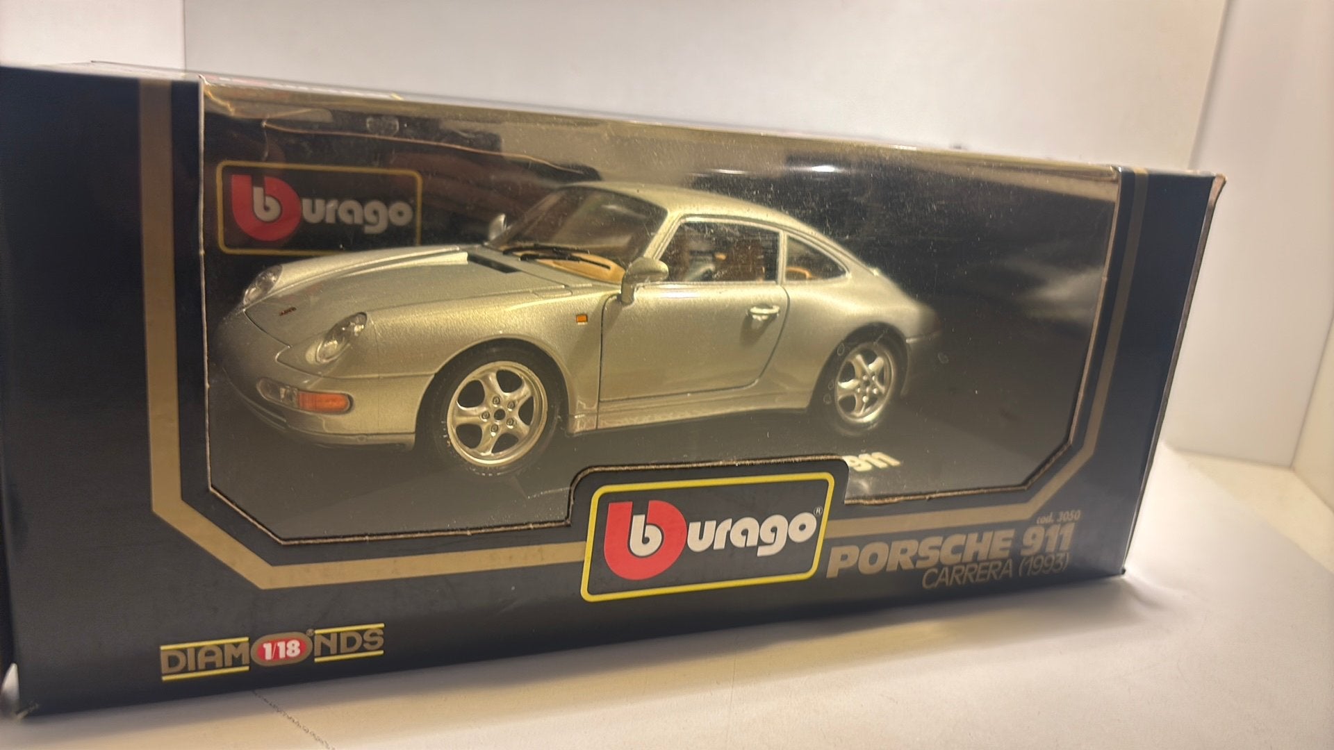 Porsche 911 carrera 1993 Bburago 1.18, Hobby en Vrije tijd, Ophalen of Verzenden, Bburago, A, A