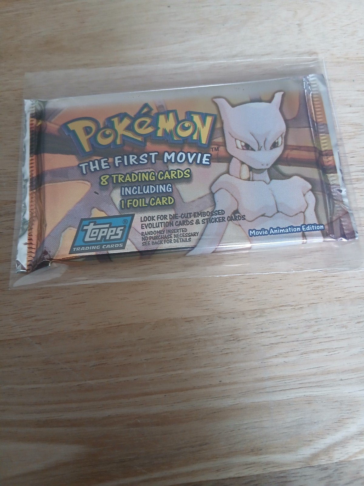 Pokemon The first movie topps pack, Ophalen of Verzenden, Zo goed als nieuw, Booster, Foil
