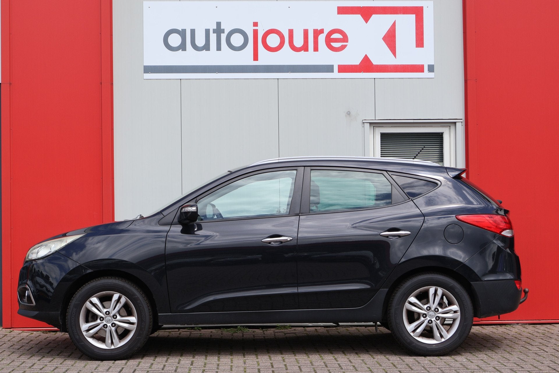 Hyundai ix35 2.0i Style (bj 2011), Auto's, Gebruikt, Zwart, 4 cilinders, Leder en Stof
