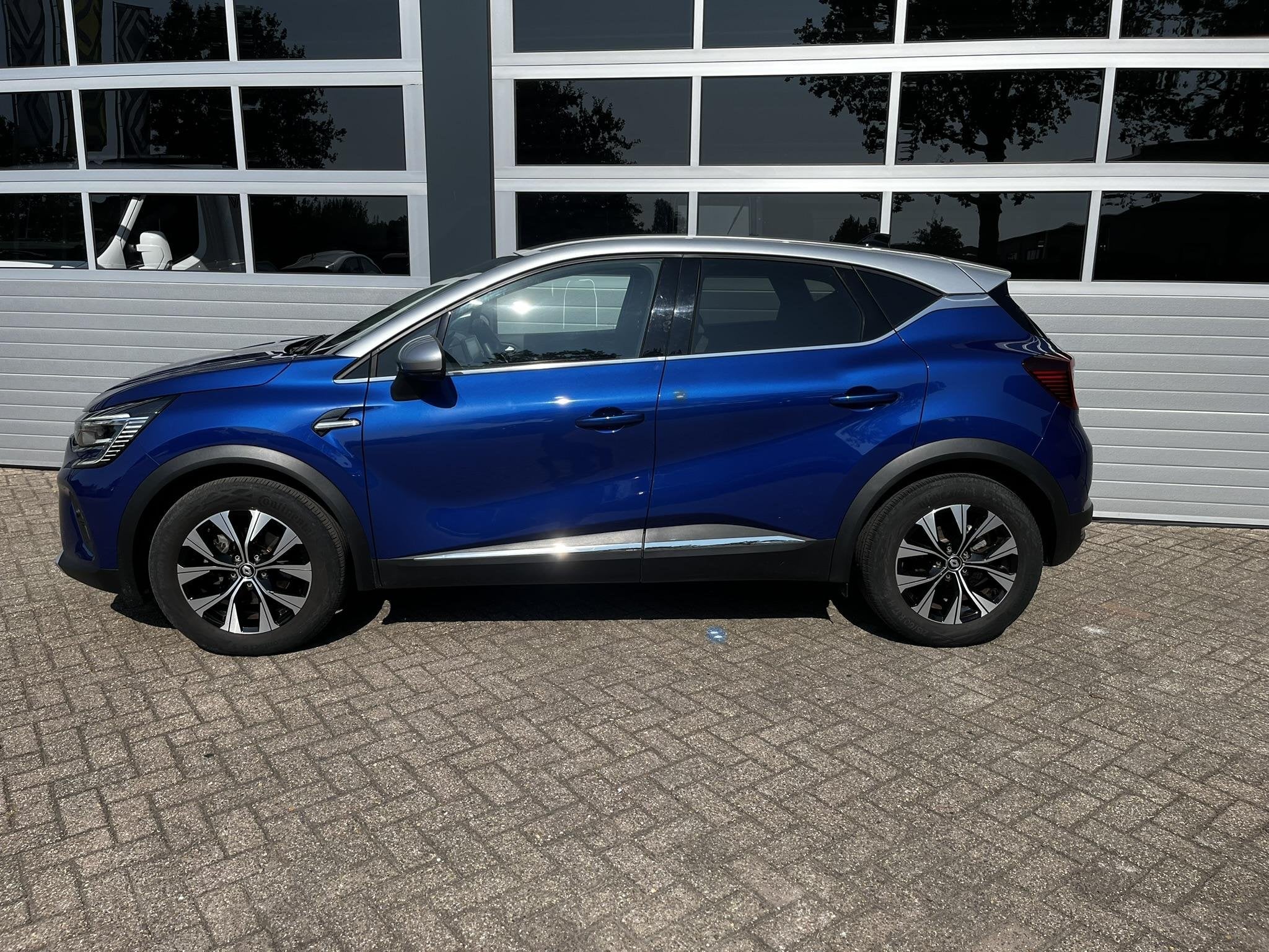 Renault Captur 1.6 E-Tech Hybrid 145 Techno, Auto's, Renault, 12 maanden, Gebruikt, Blauw, Leder