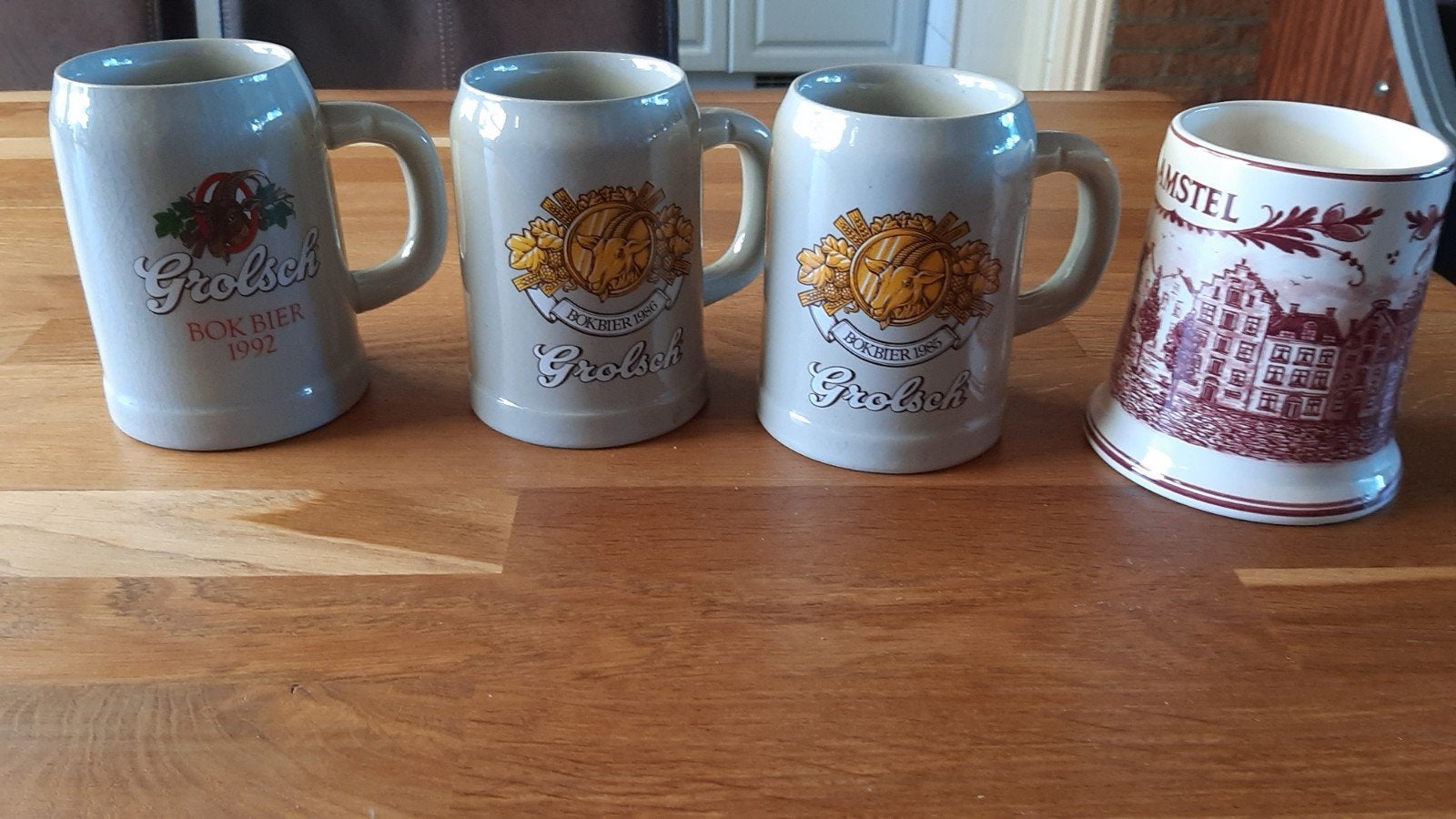 4 aardewerk bierpullen - Grolsch en Amstel, Ophalen
