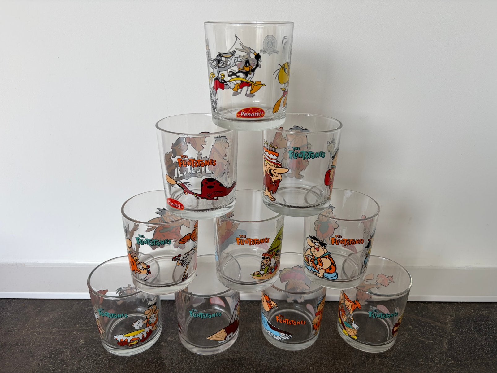 Set glazen van 9 st van de flintstones penotti uit 1997, Ophalen, Zo goed als nieuw, Frisdrankglas