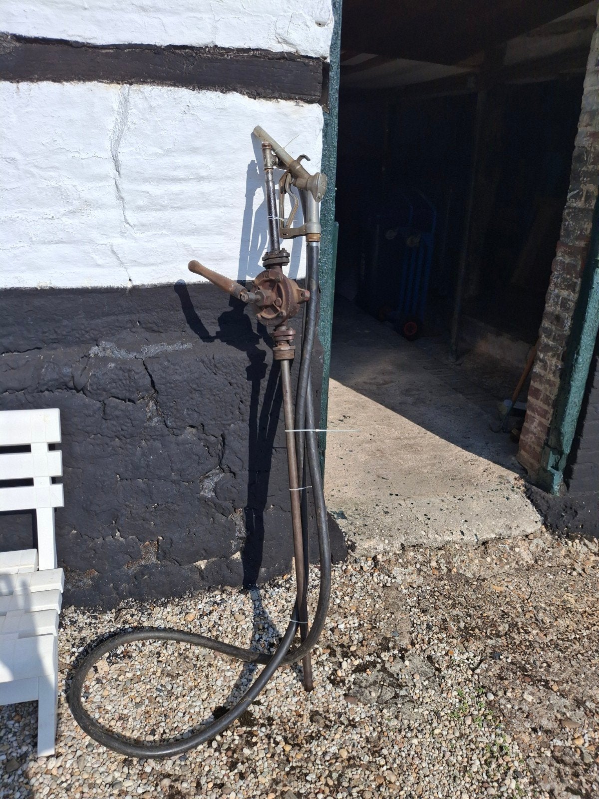 handpomp met slang en vulpistool, Ophalen