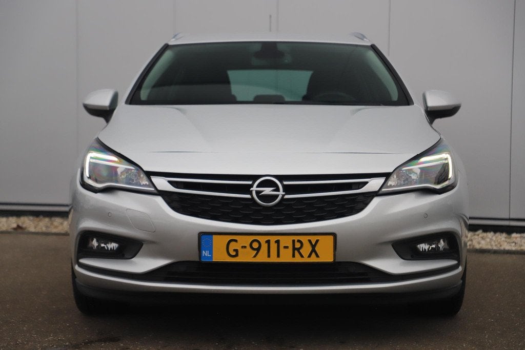 Opel Astra Sports Tourer 1.0 Turbo 120 Jaar Edition 16 inch, Stof, Gebruikt, Euro 6, 1178 kg