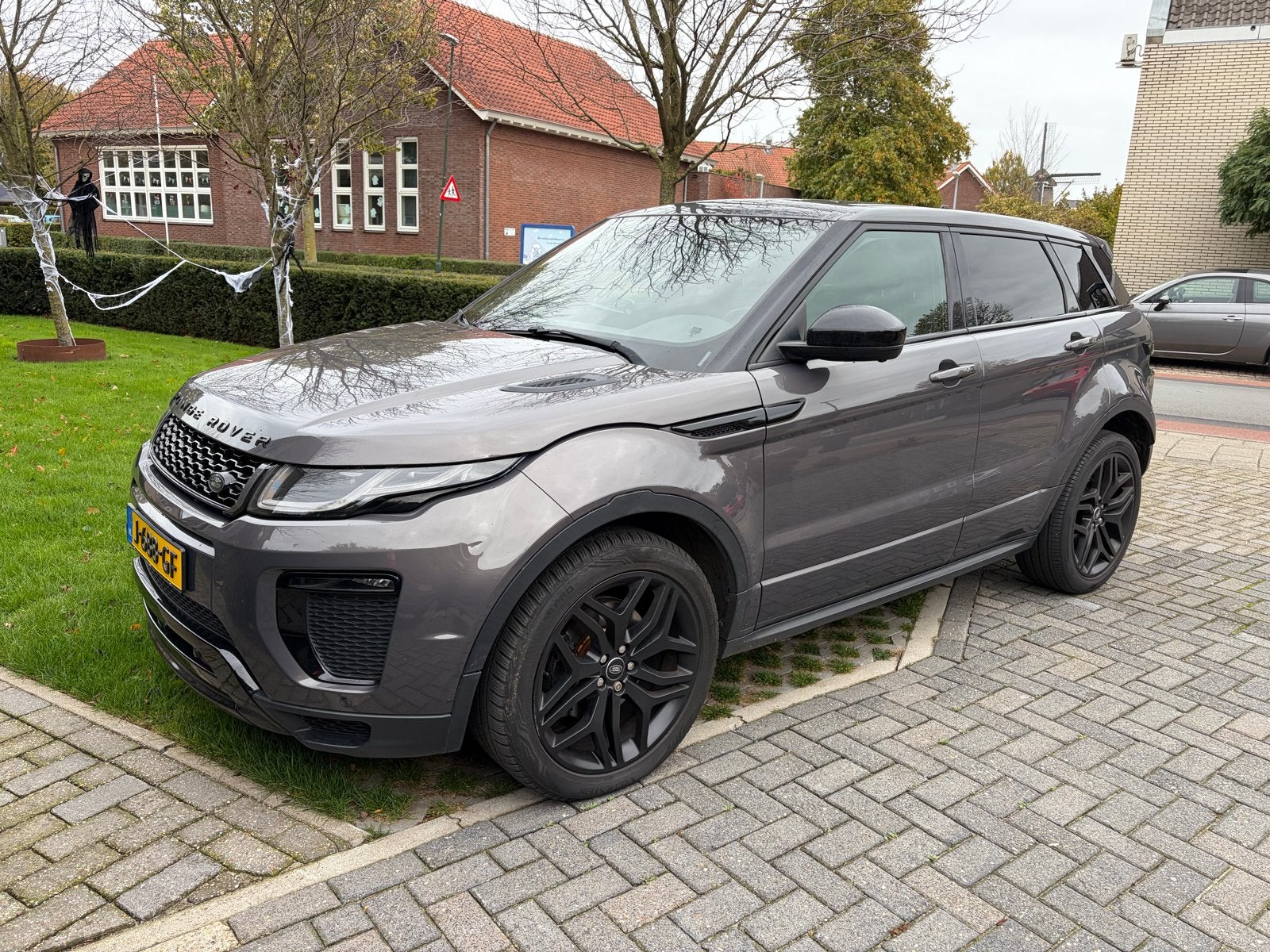 Land Rover Range Rover Evoque 2.0 TD4 4WD AUT 2015 Grijs, Auto's, Automaat, Dealer onderhouden, 2000 kg, 179 pk