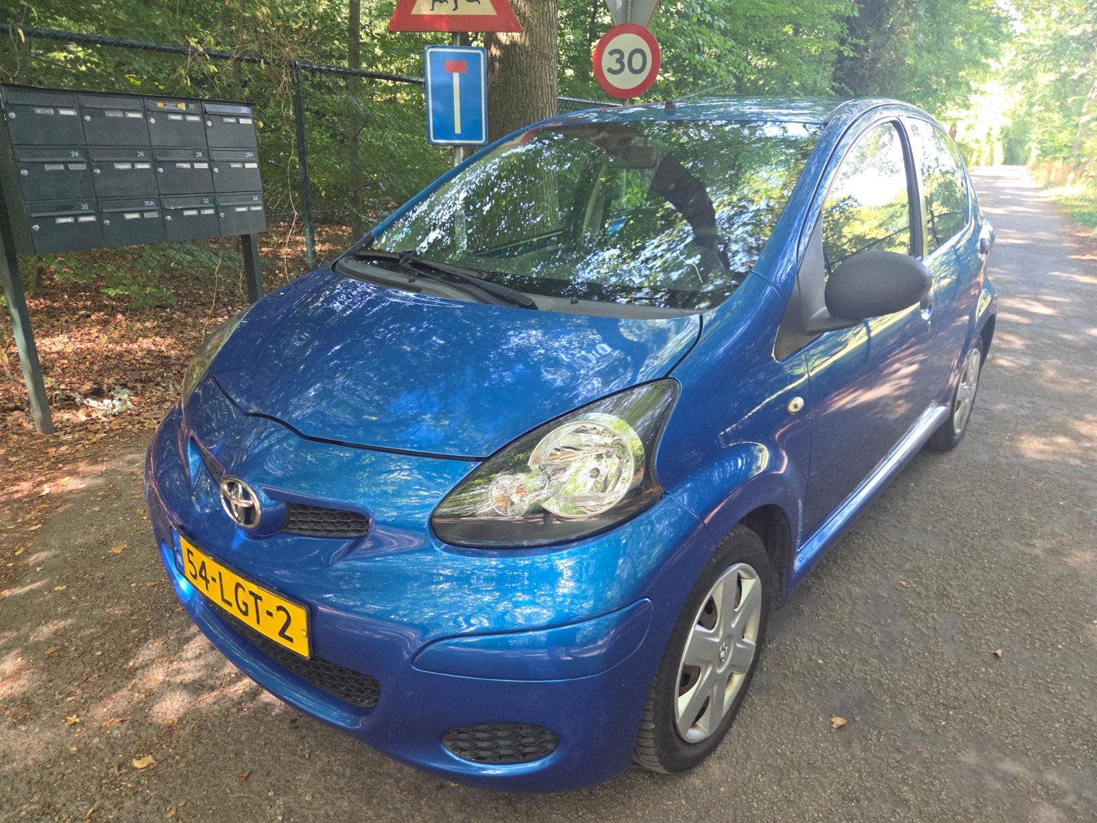 Toyota Aygo 1.0 12V Vvt-i 5DRS 2010 Blauw, Auto's, Toyota, Voorwielaandrijving, Stof, Zwart, Metallic lak