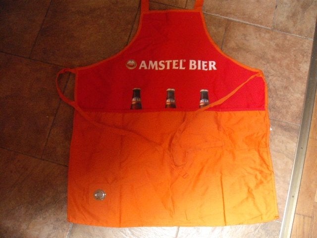 Amstel schort (nr.2)  met opener, Ophalen of Verzenden, Nieuw, Kleding, Amstel
