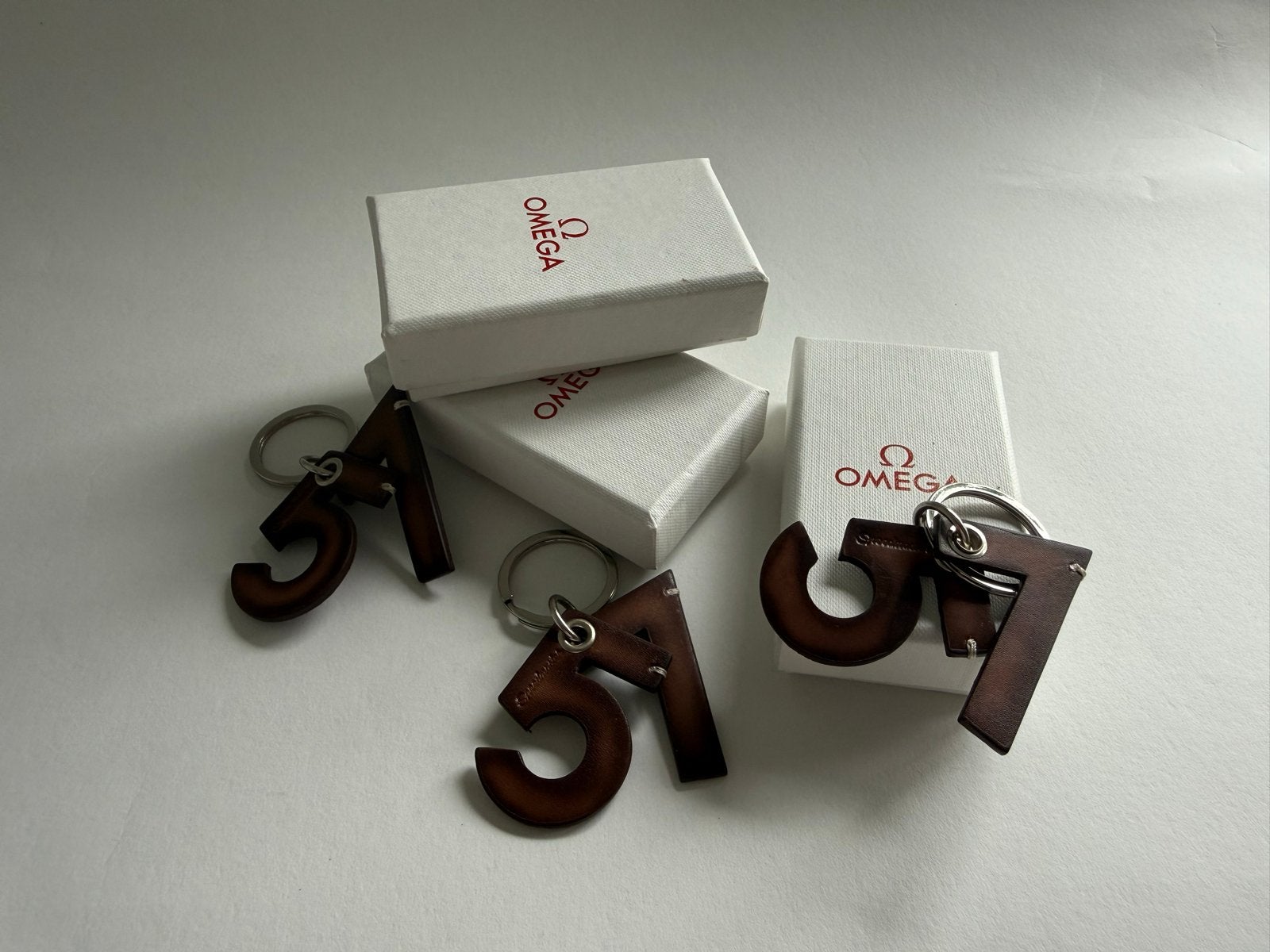 3x Omega Sleutelhanger 51/57 - Nieuw in doosje, Ophalen of Verzenden, Nieuw, Merk