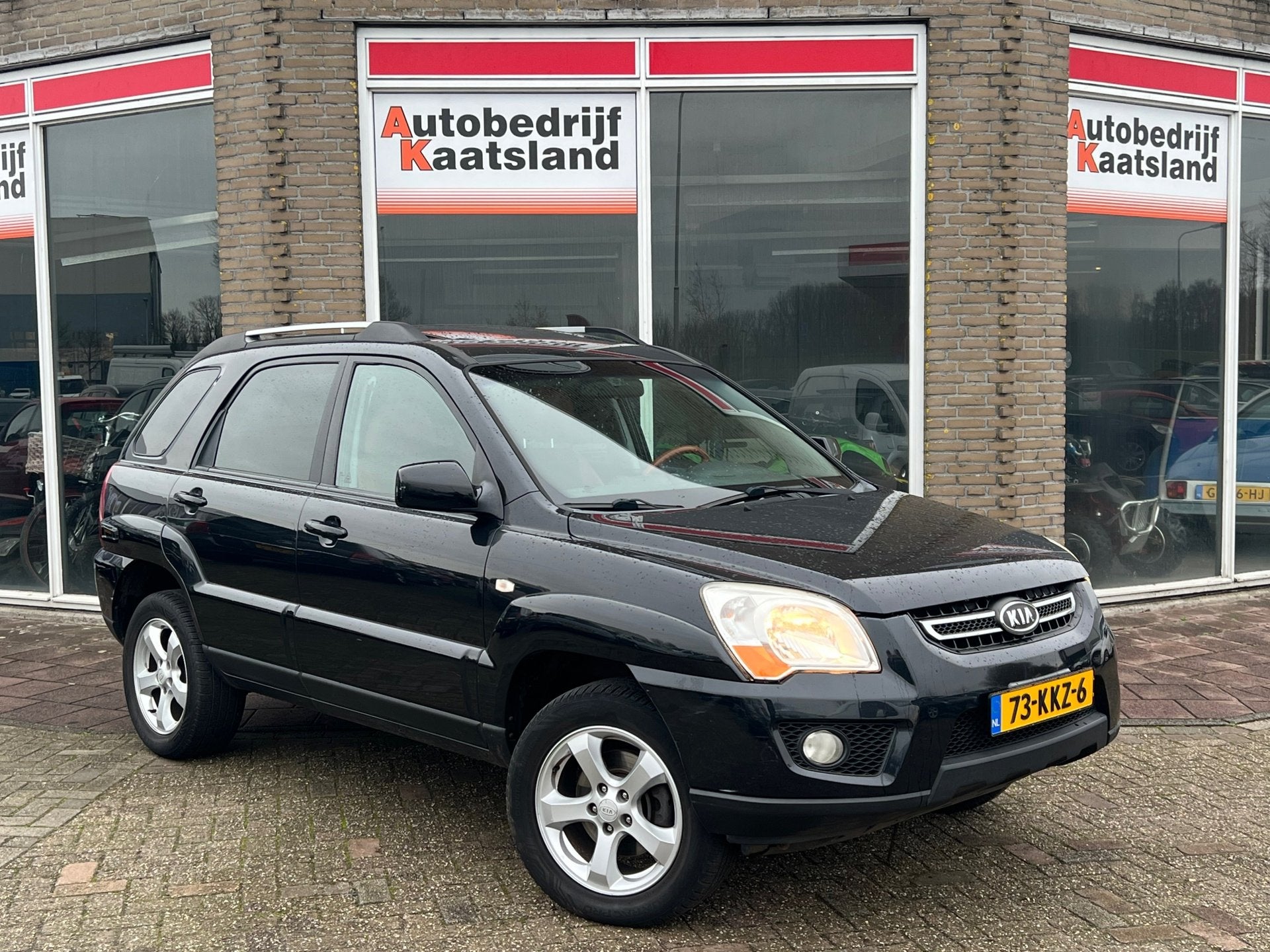 Kia Sportage 2.0 CVVT Fifteen - Leer - Clima - Cruise -, Auto's, 1442 kg, Gebruikt, Zwart, 4 cilinders