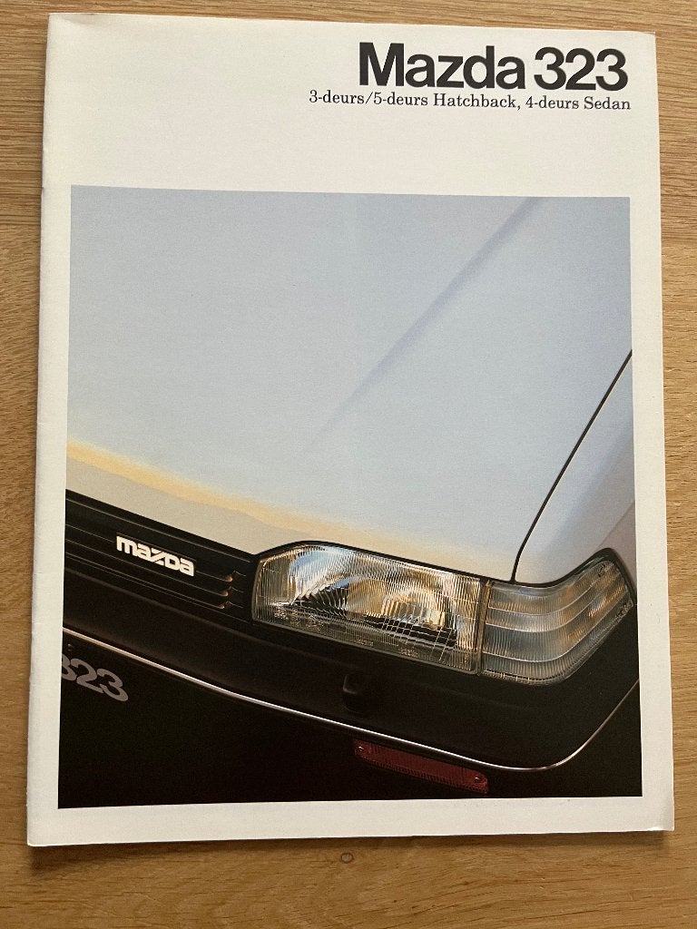 Autofolder/Brochure Mazda 323 1987 06/87, Boeken, Ophalen of Verzenden, Nieuw, Mazda