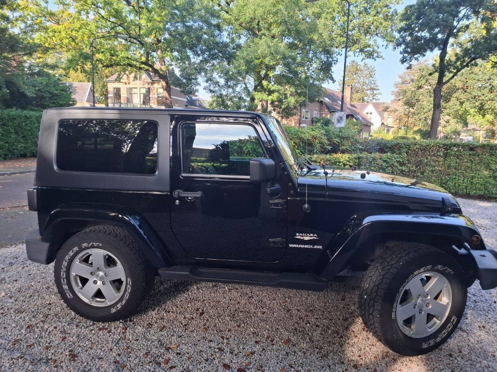 Jeep Wrangler 3.8 I V6 AUT AWD 2010 Zwart Hard & Softtop, 2000 kg, 4 stoelen, Zwart, 1725 kg