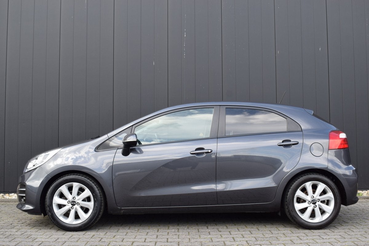Kia Rio 1.2 CVVT ExecutiveLine ECC | Full Map Navi | Camera, Auto's, 1027 kg, 4 cilinders, Met garantie (alle), Verwarmde buitenspiegels