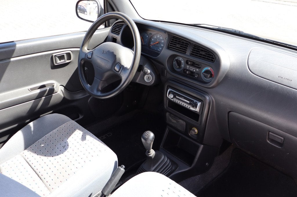 Daihatsu Cuore 1.0-12V DVVT Airco Uniek! MEENEEMPRIJSJE, Auto's, Daihatsu, Voorwielaandrijving, Airbags, 18 €/maand, 4 stoelen