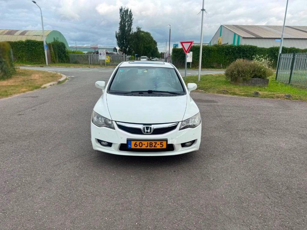 Honda Civic 1.3 Vtec Hybrid 4DR C-tr 3 EN 6 MAANDEN GARANTIE, Auto's, Wit, Origineel Nederlands, Bedrijf, 22 km/l