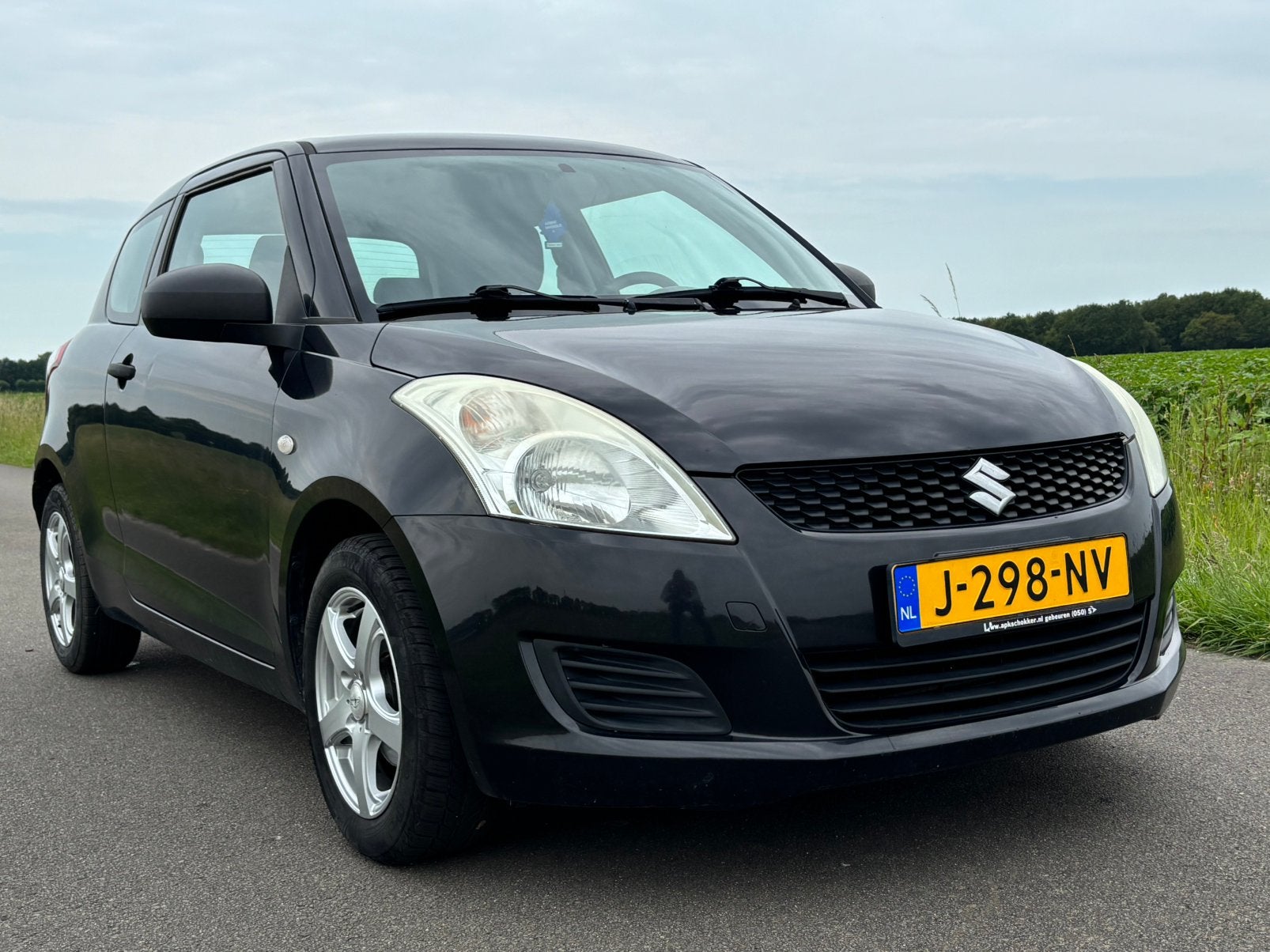 Suzuki Swift 1.2 3-D 2011 Zwart, Auto's, Voorwielaandrijving, Stof, Bedrijf, Handgeschakeld