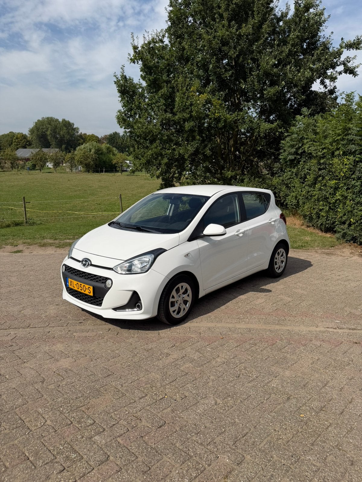 Hyundai i10 1.0i Comfort | Cruise | Dealer onderhouden |, Auto's, Voorwielaandrijving, Stof, 31 €/maand, 4 stoelen