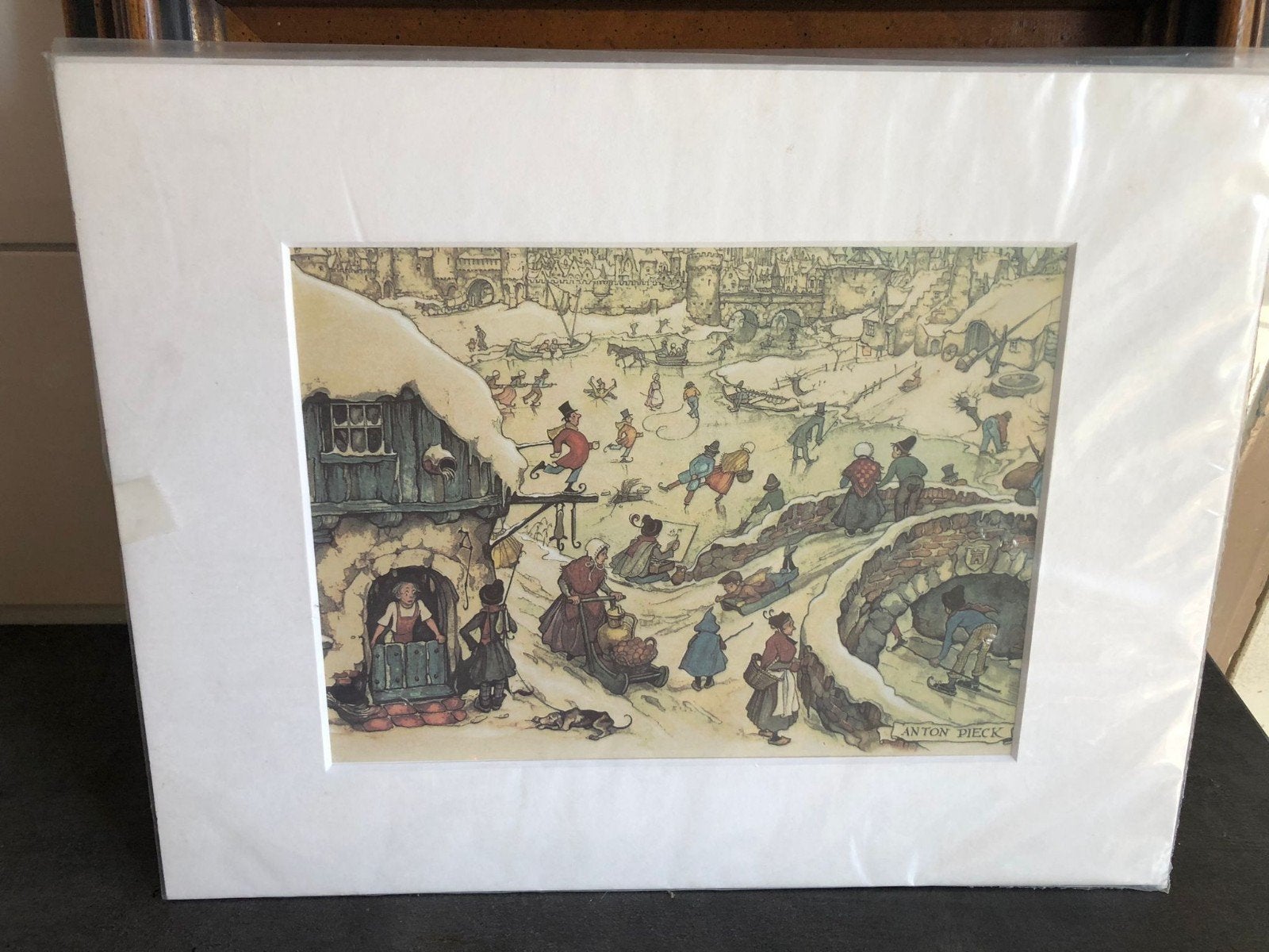 Anton Pieck Print: Wintertafereel met schaatsers, Antiek en Kunst, Ophalen of Verzenden, Print, Prent, Met passe-partout