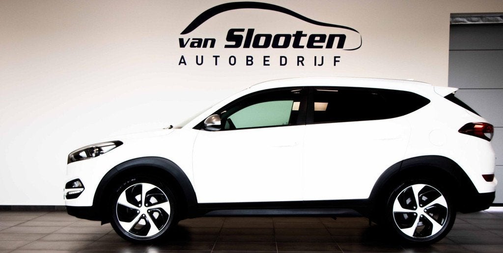 Hyundai Tucson 1.6 T-GDi Comfort 4WD| Navi| Camera| Cruise|, Auto's, Hyundai, Stof, Gebruikt, 4 cilinders, Wit