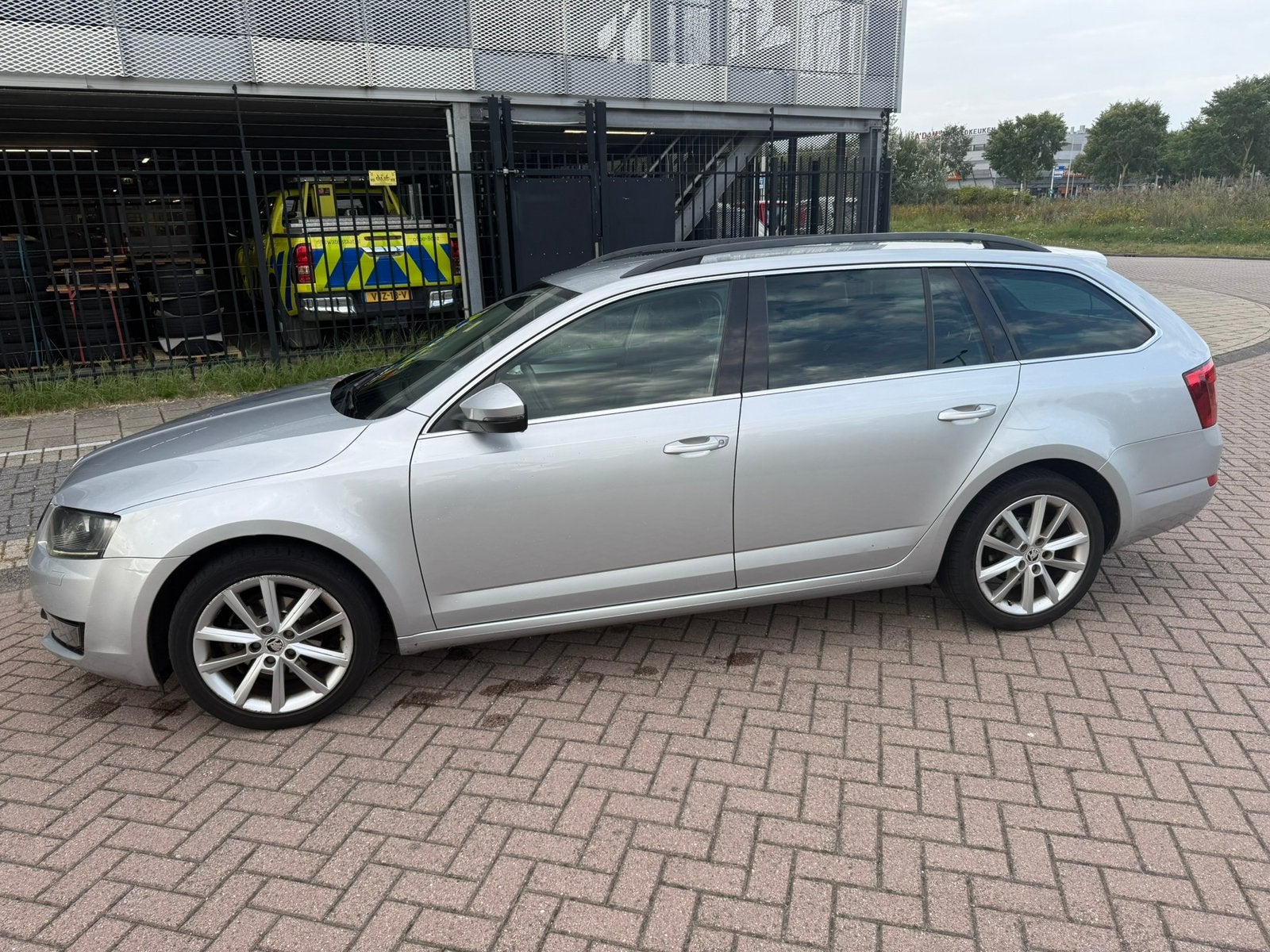 Skoda Octavia 1.6 TDI 77KW Combi Dsg-7 2014 Grijs, Auto's, Zwart, 4 cilinders, Leder en Stof, Particulier