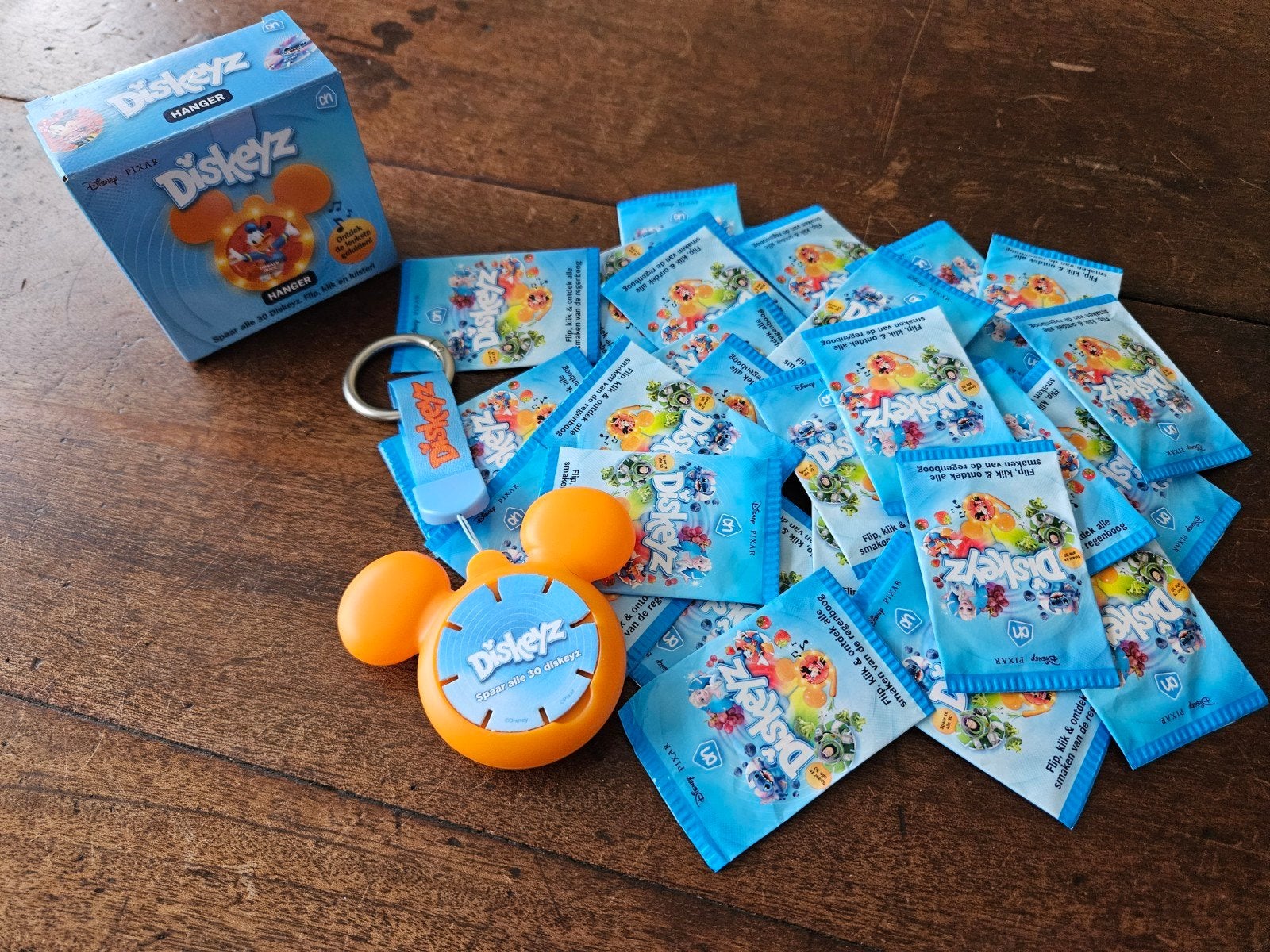 33 ongeopende Diskeyz pakjes met nieuwe oranje hanger, Albert Heijn, Ophalen of Verzenden