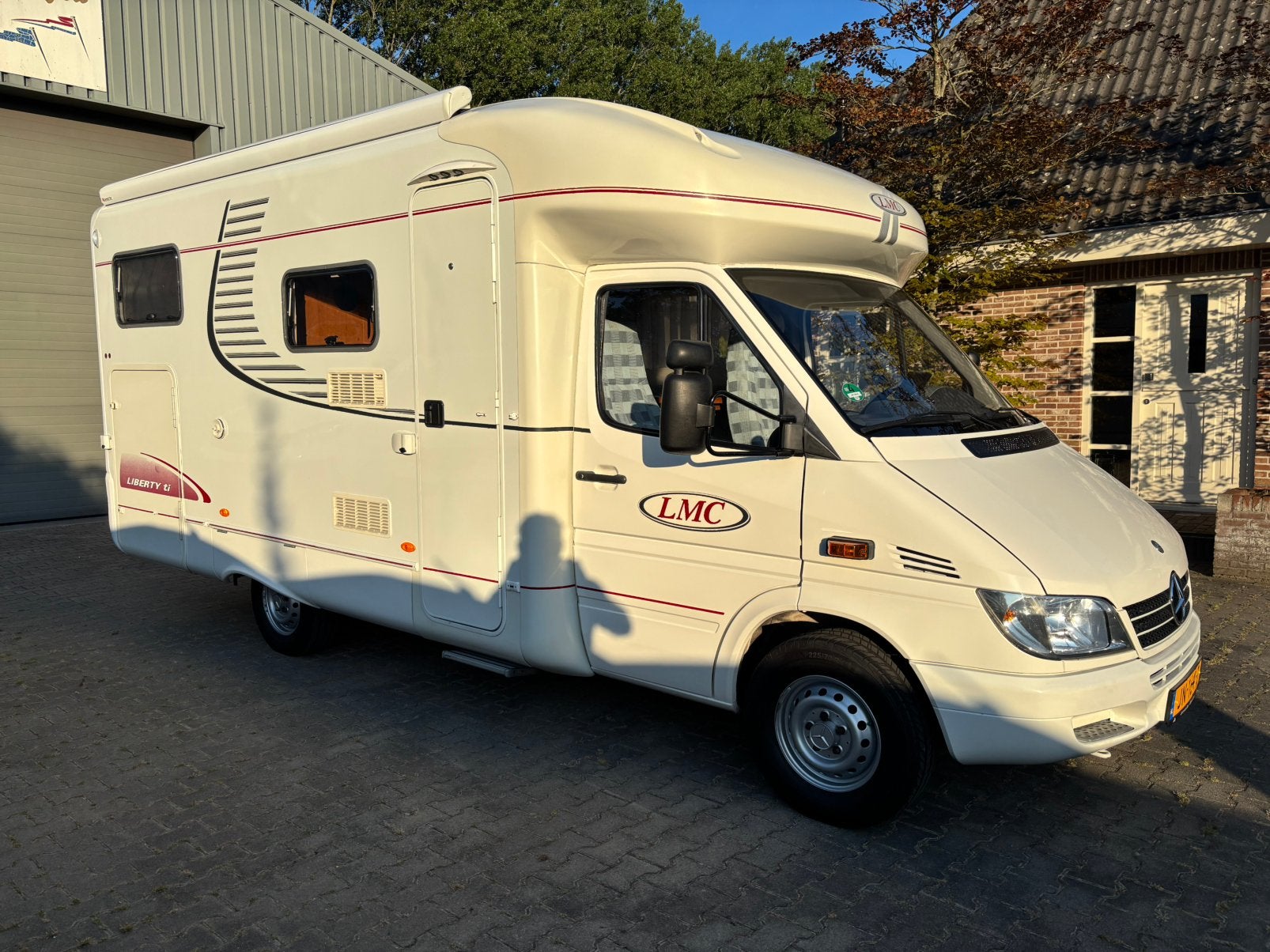 LMC Liberty 6005 TI, Caravans en Kamperen, Campers, Ringverwarming, Luifel, Tot en met 2, 6 tot 7 meter