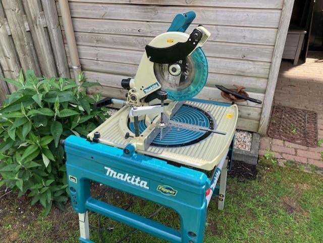 z.g.a.n.afkort/tafelzaag makita lf 1000 flip over, Ophalen, 70 mm of meer, Zo goed als nieuw, Afkortzaag
