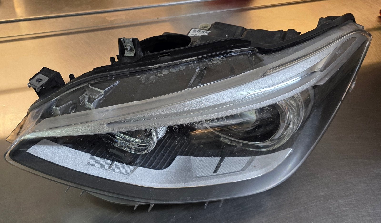 BMW 1 serie f20 Xenon koplamp links werkt 100%, Ophalen of Verzenden, BMW