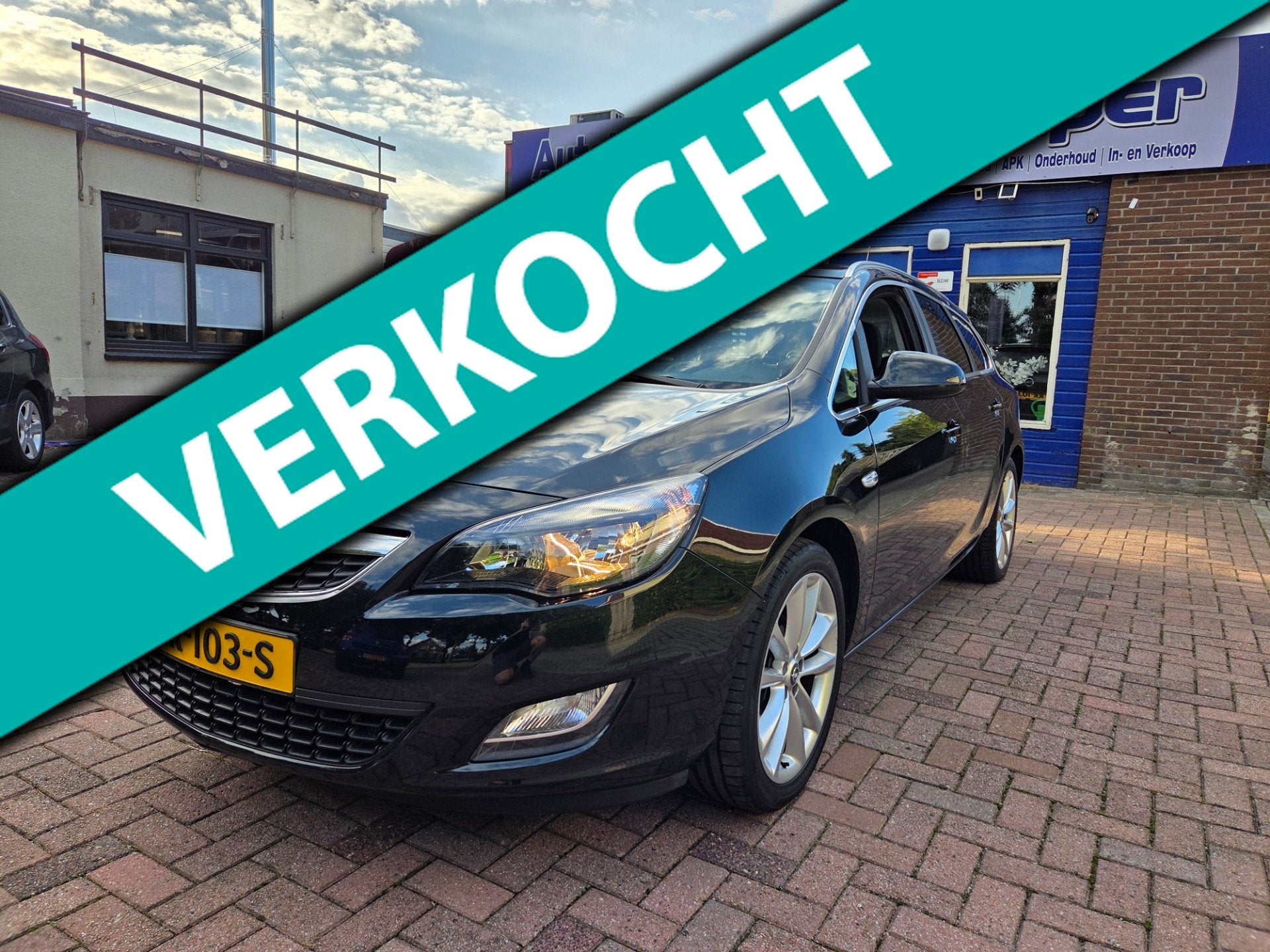 Opel Astra Sports Tourer 1.4 Turbo Cosmo, Voorwielaandrijving, Euro 5, Stof, Zwart