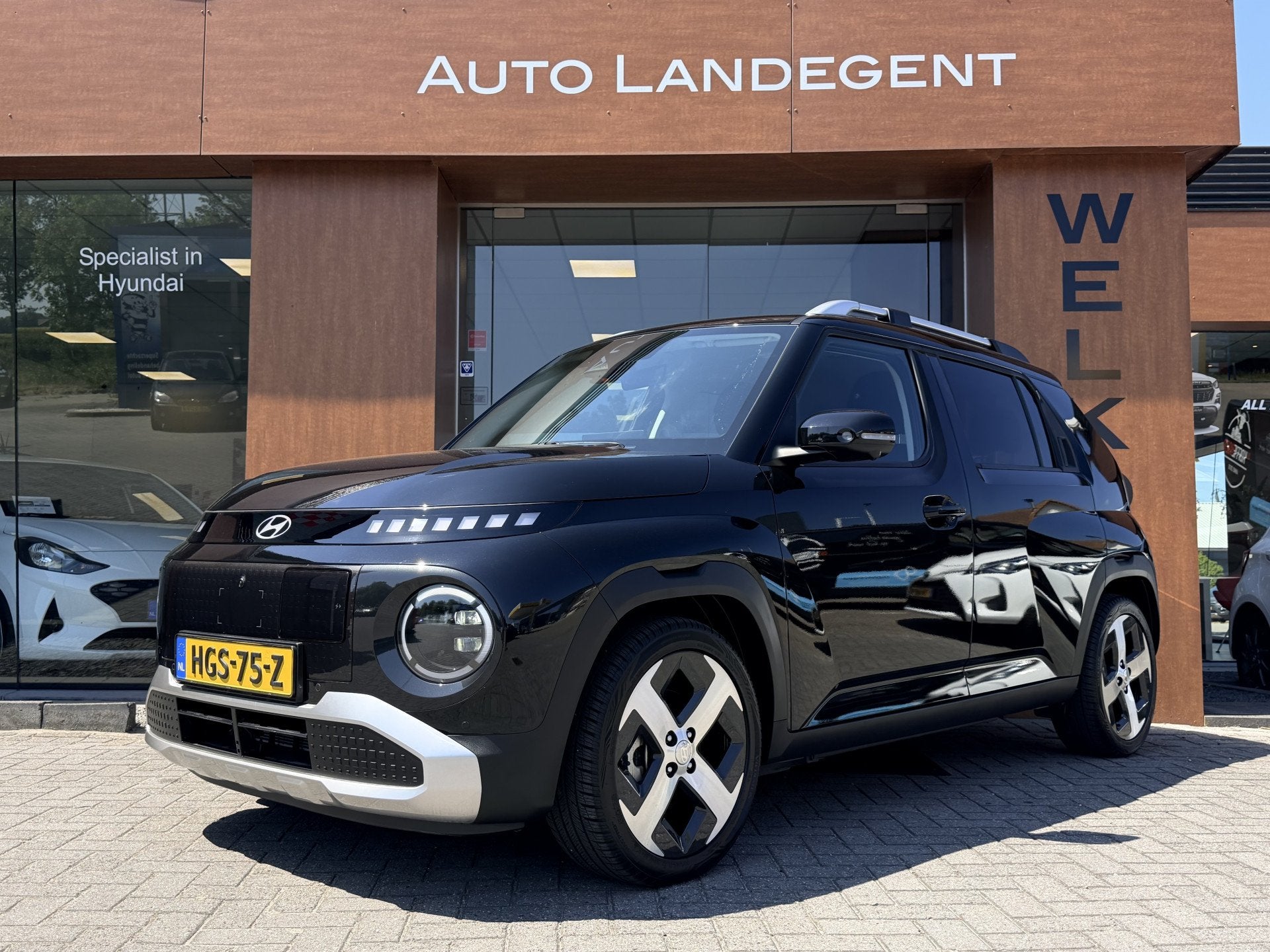 Hyundai Inster Evolve Plus 49 kWh +Winterpack | Apple/Androi, Auto's, Stof, Gebruikt, 116 pk, Zwart